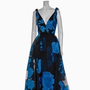Carolina Herrera Gown.  New with tags, black with blue floral.